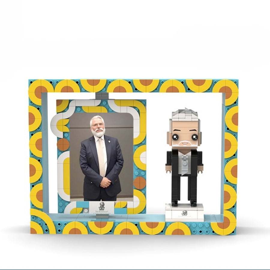 Custom brick figure and matching photo of a man in suit displayed in a colorful geometric frame – MiniMate Store corporate gift example