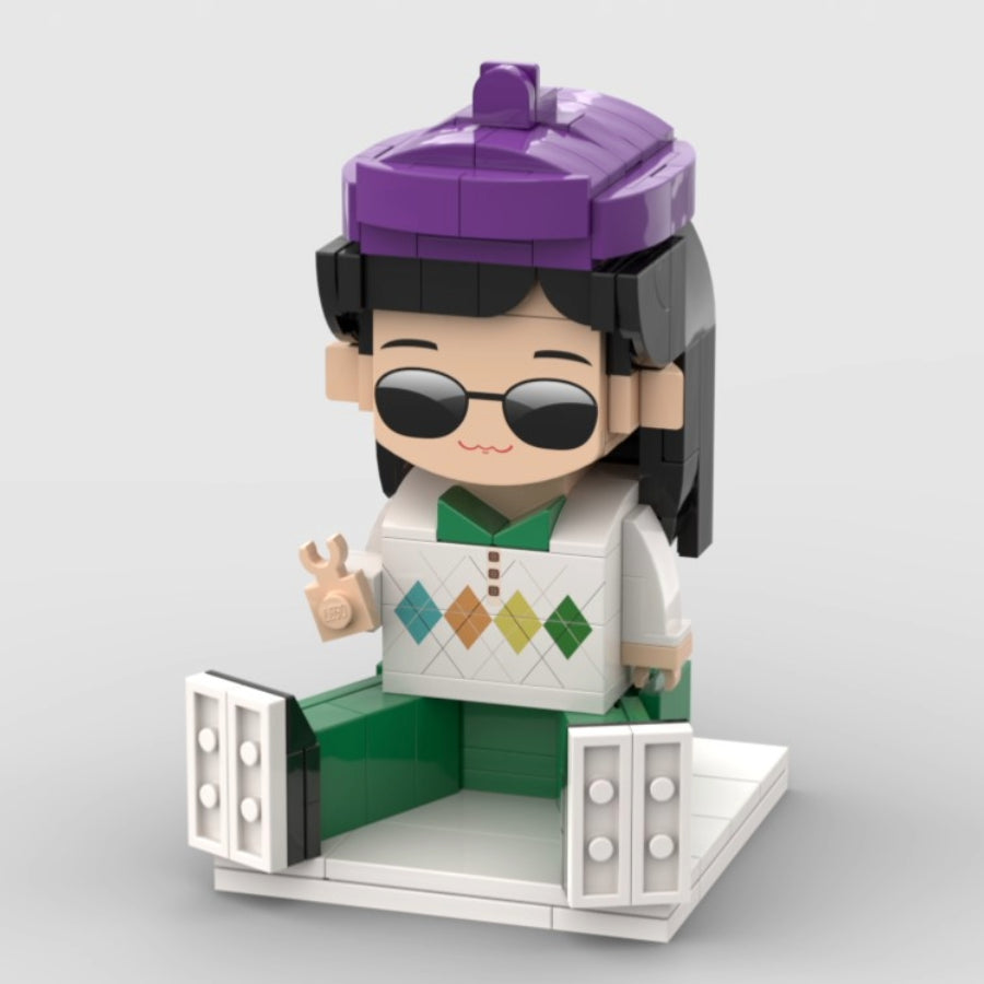 Custom mini brick figure with purple beret, sunglasses, and argyle sweater – seated pose collectible from MiniMate Store